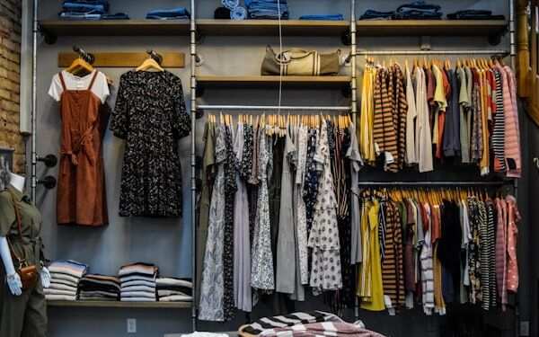 Fashion retail store with clothing rails — apparel sell-through and size-curve analytics by Novasoft