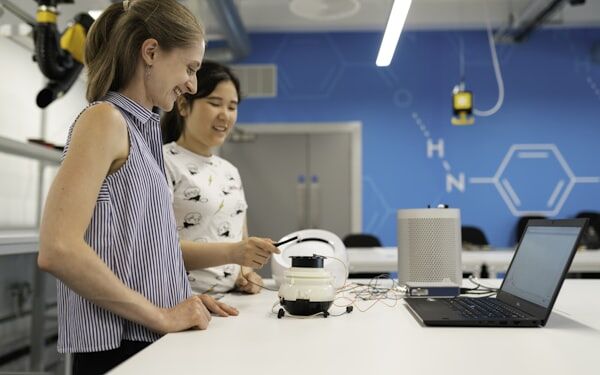 Modern lab with engineers at workstation