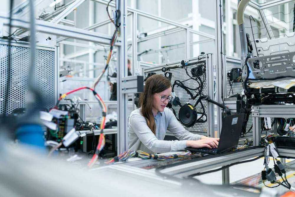 Modern manufacturing line with engineer — D365 F&O tenant on Novacare