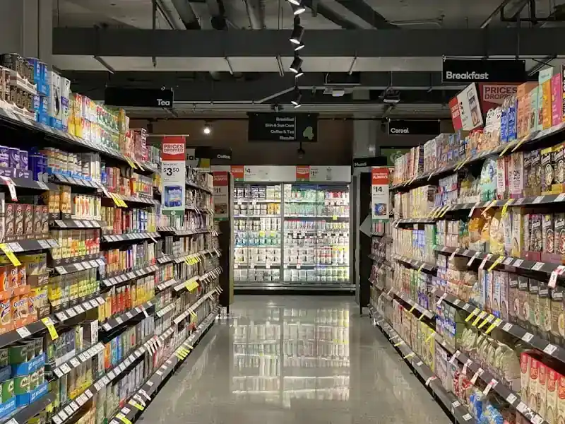 Grocery and FMCG distribution &mdash; supermarket aisle showing wholesale supply to retail chains
