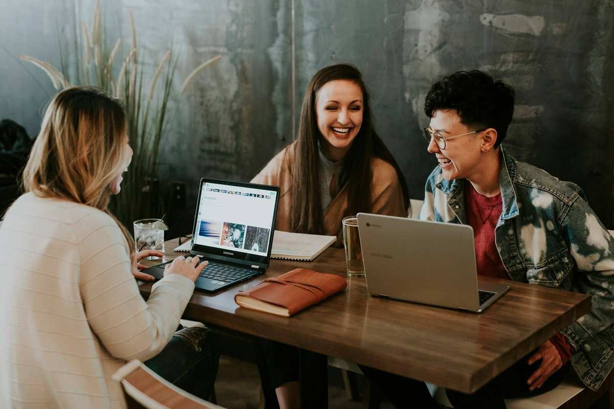 Microsoft 365 — hybrid team collaborating on Teams and laptops